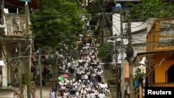 Desplazados de Tila participan en una peregrinación para exigir al gobierno el retorno seguro a sus comunidades, en Yajalón (Junio 19, 2024. REUTERS/Jacob Garcia)