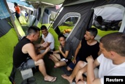 Migrantes cubanos en el refugio Senda de Vida, en Reynosa, Mexico, en mayo de 2022. (REUTERS/Daniel Becerril)