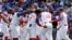 El equipo cubano celebra la victoria sobre Taiwán. (AP/I-Hwa Cheng)