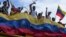 Manifestantes protestan contra los resultados oficiales de las elecciones que declaran la reelección del presidente Nicolás Maduro en Valencia, Venezuela. (AP/Jacinto Oliveros)