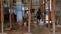 Madre de tres menores ocupa en Holguín edificio con riesgo de derrumbe