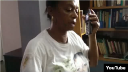 Reporta Cuba. Dama de Blanco Jacqueline Boni fue severamente maltratada ayer en La Habana. Foto: tomada de Youtube.
