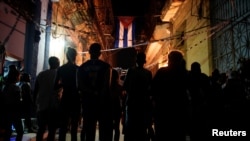 Cubanos en una reunión del CDR en septiembre de 2019. REUTERS/Alexandre Meneghini