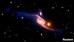 La galaxia NGC 6872 fotografiada por la NASA.
