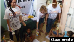 Reporta Cuba. Activistas de FLAMUR trabajando en el proyecto La Edad de Oro.