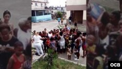 Damas de Blanco reparten juguetes a niños frente a la sede del movimiento opositor en Lawton, La Habana. 