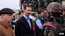 En el centro el mandatario sirio Bashar Al Assad