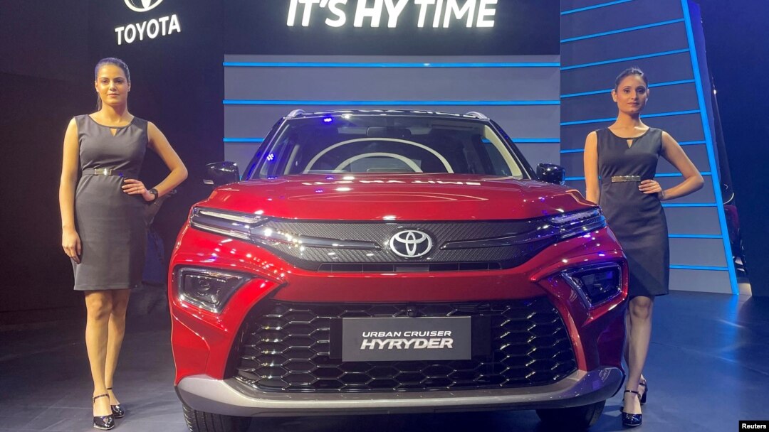 FILE PHOTO: Models pose at the unveiling of Toyota's new hybrid SUV Urban Cruiser Hyryder in New Delhi