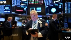 Wall Street stocks (Photo by Johannes EISELE / AFP)