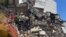 Equipos de rescate buscan supervivientes entre los escombros de un edificio colapsado tras un terremoto en Pereira, Colombia, el 10 de agosto de 2026.