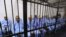 IVarios funcionarios destacados del régimen del fallecido dictador libio Muamar el Gadafi, comparecen acusados de crímenes presuntamente cometidos en Libia del 15 al 28 febrero de 2011, en Trípoli, Libia. Archivo.