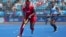 Cuba's Yunia Milanes (L) carries the ball during the field hockey women's team 5-6 classification match between Uruguay and Cuba during the Pan American Games Santiago 2023, at the Field Hockey Sports Centre of the National Stadium Sports Park in Santiago