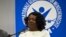 Berta Soler habla en la plenaria y el traductor Edgar Lamm  