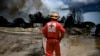 La Cruz Roja en Matanzas, frente al incendio de los supertanqueros, el 9 de agosto de 2022. (Yamil Lage, Pool photo via AP)