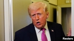 El presidente Donald Trump a bordo del Air Force One, el domingo 29 de marzo de 2026. (REUTERS/Elizabeth Frantz)