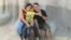La doctora Dianelys San Roman Parrado junto a su niño y su esposo.