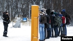 Migrantes en la frontera entre Rusia y Noruega. REUTERS/Cornelius Poppe/NTB Scanpix