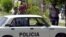 Policías bloquean las calles de acceso al Tribunal Municipal de 10 de Octubre, durante los juicios contra 76 disidentes políticos. Foto: Archivo.