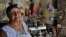 Carmen, una campesina espiritista, posa junto a su altar el pasado 5 de agosto de 2011 en la zona rural de la ciudad de Baracoa.