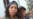 Gisselle Ordóñez Milián, conocida en las redes sociales como Zea Gisselle, junto a su hijo en las afueras de la unidad policial