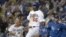 Archivo - Yasiel Puig tras llegar al plato en un juego contra los Mets de Nueva York en el Dodger Stadium de Los Ángeles, California.