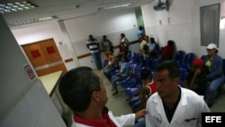Part of the "Barrio Adentro", or Inside the Neighborhood program, two Cuban doctors talk in the Integral Diagnostic Center.