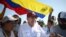 (FILES) (FILES) The Venezuelan opposition presidential candidate for the Plataforma Unitaria Democratica party, Edmundo Gonzalez Urrutia (C), greets supporters upon his arrival at the campaign act in Barlovento Town in Miranda State, Venezuela, on June 26