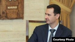 El presidente Bashar Al Asad (dcha) se reúne con el enviado de la ONU y de la Liga Árabe para Siria, Kofi Annan (izda), en el Palacio Presidencial en Damasco. 