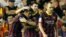 El delantero argentino del FC Barcelona Leo Messi (c) celebra su tercer gol con el brasileño Neymar Da Silva (i), junto a Andrés Iniesta, durante el partido que disputaron Valencia CF y FC Barcelona.