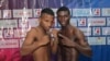 (i-e) Joahnys Argilagos y Yuberjen Martínez, en la Serie Mundial de Boxeo en Cartagena, Colombia.