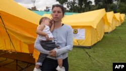 Migrantes venezolanos en un campo para refugiados en Bogotá, Colombia. (Raul Arboleda / AFP).