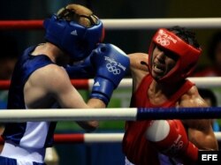 El colombiano Darleys Pérez (rojo) y el ruso Alexey Tishchenko, en los Juegos Olímpicos de 2008.