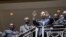El ex dictador haitiano, Jean Claude Duvalier (c), también conocido como "Baby Doc", saluda a sus partidarios desde las escaleras del hotel Karibe, en Puerto Príncipe, Haití, Foto de archivo