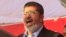 El expresidente egipcio Mohamed Morsi en una de sus intervenciones en la plaza Tahrir en 2012.