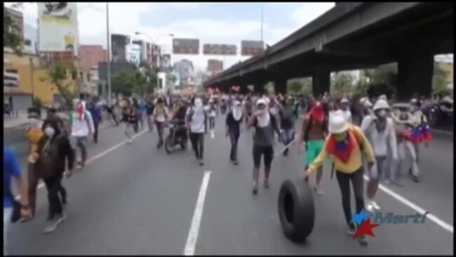 Nueva batalla campal entre opositores y chavistas en calles venezolanas