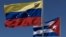 ARCHIVO. Las banderas de Cuba y Venezuela en la inauguración de los trabajos de instalación del cable de fibra óptica que aspira a convertirse en un sistema de comunicaciones independiente en la zona del Caribe.