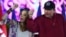 (FILES) This handout picture released by the official El 19 Digital news outlet shows Nicaraguan President Daniel Ortega and Co-President Rosario Murillo gesturing during Labor Day celebrations in Managua on 30 April, 2025.