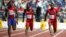 Atletas Reynier Mena (Cuba), Marcus Duncan (Trinidad y Tobago), y BeeJay Lee (EEUU), en la ronda preliminar de los 100 metros planos de los Juegos Panamericanos 2015 (i-d).