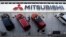Varios coches Mitsubishi se reflejan en el techo acristalado de la sede de Mitsubishi Motors Corp.'s en Tokio. 