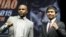 El boxeador estadounidense Floyd Mayweather Jr. (i) y el boxeador filipino Manny Pacquiao posaron durante una rueda de prensa el 11 de marzo de 2015, en Los Ángeles, California (EEUU).
