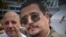 Rogelio Bolufé junto a Carlos Lazo, jefe de la agrupación pro castrista "Puentes de Amor".
