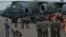 Bomberos, militares y técnicos de telecomunicaciones brasileños embarcan en un avión  para una misión de ayuda humanitaria a Venezuela en el estado de São Paulo, Brasil, el 26 de junio de 2026.