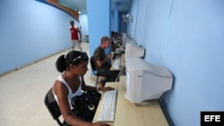 Several people access the Internet in Havana, Cuba.