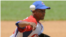 Peloteros cubanos en acción.