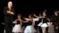 Foto de archivo de 2004. El maestro Fernando Alonso (der), creador de la Escuela Cubana de Ballet recibe el aplauso de las nuevas generaciones durante un homenaje organizado por el Centro Pro Danza, el  viernes 30 de julio en el Gran Teatro de La Habana.
