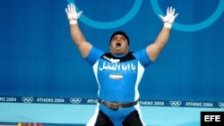 atleta iraní reza en juegos olímpicos