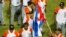 Jugadores de Villa Clara, Cuba, celebraban su victoria ante Indios de Mayagüez de Puerto Rico el 4 de febrero de 2014, durante un juego de la Serie del Caribe 2014, en el Estadio Nueva Esparta, en Margarita (Venezuela).