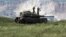 Soldados israelíes encima de un tanque en los Altos del Golán. 