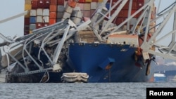 Un buque con bandera de Singapur impactó una columna de soporte del puente Francis Scott, en Baltimore. (REUTERS/Julia Nikhinson)