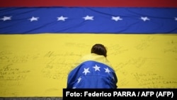 Marcha de protesta para exigir elecciones en Caracas, el 28 de julio de 2026. (Foto de Federico PARRA / AFP)